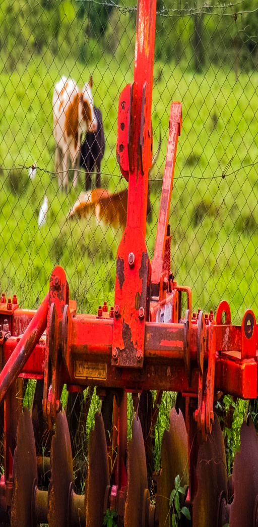 Agricultural machinery working in a field